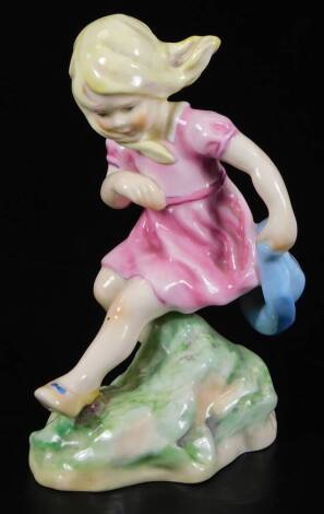 A Royal Worcester figure, representing March's child, wearing a pink dress, no. 5454, by F.C. Doughty, black marked, 15cm H.