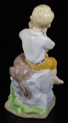 A Royal Worcester figure, representing June's child, wearing yellow shorts with dog, no. 3456, by F.C. Doughty, black marked, 16cm H. - 2