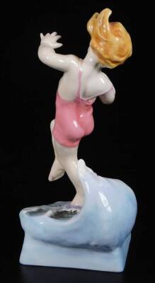 A Royal Worcester figure, representing July's child, wearing a pink swimsuit, by F.C. Doughty, no. 3440, black marked, 18cm H. - 2