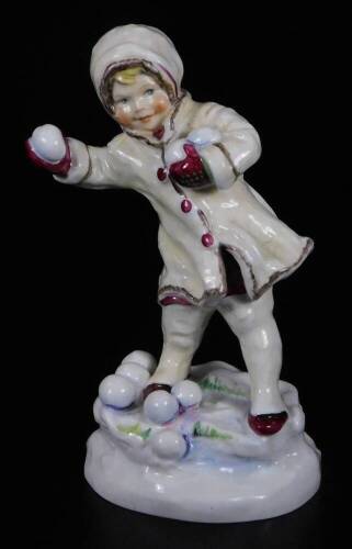 A Royal Worcester figure, representing December's child, playing snowballs, no. 3458, by F.C. Doughty, black marked, 17cm H.