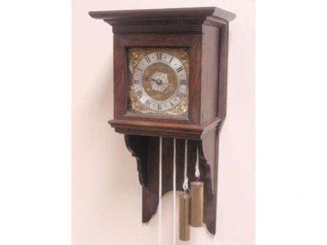 A small oak wall clock