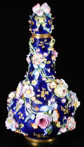 A 19thC Derby blue ground bottle vase and cover, c1835, decorated with apples and flowers and tooled gilt sprays, false crossed swords mark, 27cm H.