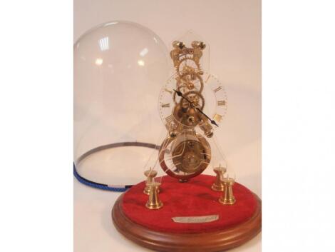 A perspex and brass skeleton clock with fuse? movement by Lewis Springfield of Grantham