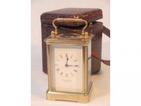 A gilt brass carriage clock inscribed Marshal & Sons