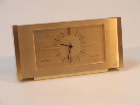 A 1960's/70's Seth Thomas quartzmatic brushed and polished brass table clock