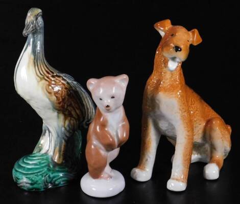 Various USSR figures, comprising of seated bearded collie, 17cm H, standing bear and a bird, marked beneath. (3)