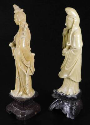 Two jadeite style figures, of females, the first in flowing robes holding bottle, on inverted base, 30cm H, the second holding fan. (2) - 2