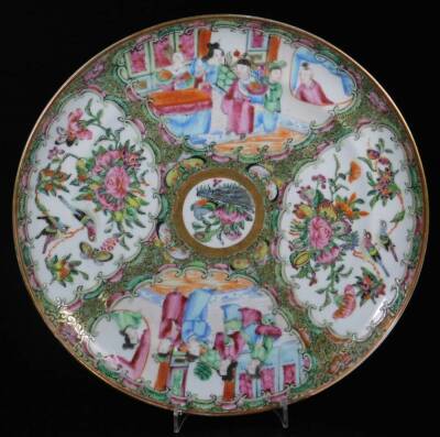 A pair of 19thC Cantonese famille rose plates, each decorated with panels of figures in interior scenes and centred by a section of flowers, predominately in pink, green and orange, 25cm Dia. with R N Myers receipt. - 5