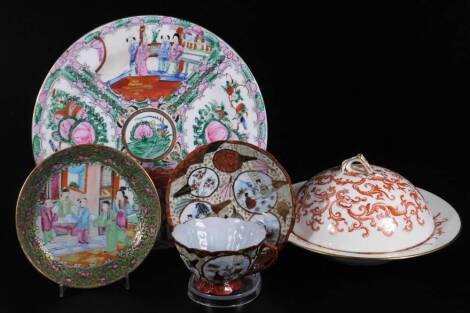 Various wares, a Cantonese famille rose plate of circular form decorated with panels of birds and flowers and a figures in an interior setting, centred by a further bird and flower, red four character beneath, 26cm Dia., a 19thC Cantonese saucer of simila