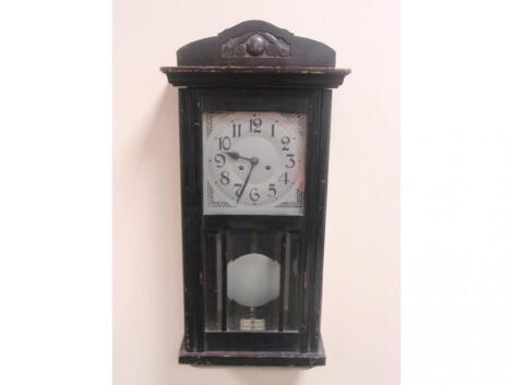 A 1930's German ebonised wall clock