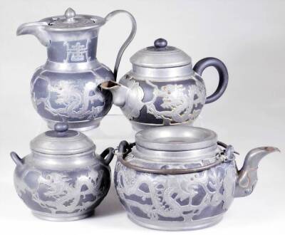 A Weihaiwei Deh Yu four piece tea service, each piece raised with dragons, to include teapot, 10cm H, two handled sugar bowl, etc. each marked beneath. (4)