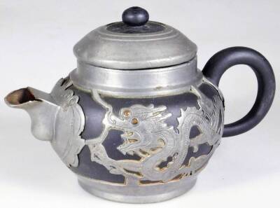 A Weihaiwei Deh Yu four piece tea service, each piece raised with dragons, to include teapot, 10cm H, two handled sugar bowl, etc. each marked beneath. (4) - 11