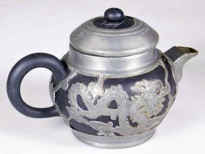 A Weihaiwei Deh Yu four piece tea service, each piece raised with dragons, to include teapot, 10cm H, two handled sugar bowl, etc. each marked beneath. (4) - 12