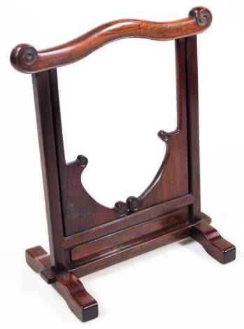 An oriental hardwood screen stand or frame, with scroll top, articulated centre and scroll feet, 32cm H, 27cm W, 16cm D.