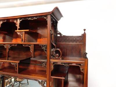 An exceptional 19thC Edwards & Roberts Japonesque rosewood Shodhana cabinet, the mirror inset aesthetic movement superstructure with an arrangement of canopied shelves on carved brackets, the top of the lower part with curved ends, having six doors with o - 4