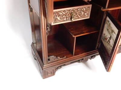 An exceptional 19thC Edwards & Roberts Japonesque rosewood Shodhana cabinet, the mirror inset aesthetic movement superstructure with an arrangement of canopied shelves on carved brackets, the top of the lower part with curved ends, having six doors with o - 5