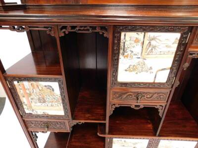 An exceptional 19thC Edwards & Roberts Japonesque rosewood Shodhana cabinet, the mirror inset aesthetic movement superstructure with an arrangement of canopied shelves on carved brackets, the top of the lower part with curved ends, having six doors with o - 8