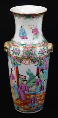 A 19thC Cantonese famille rose vase, with inverted stem and shouldered body, profusely decorated with panels of figures surrounded by flowers with further panels, predominately in pink, green, blue and orange, with gilt highlighted animal mask handles, 26