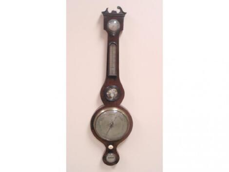 An early 19thC mahogany wheel barometer with swan neck pediment (AF)