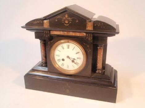 A Victorian polished slate and liver marble architectural mantel clock