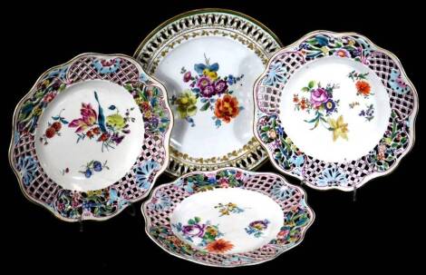 A part set of three pierced 19thC Meissen plates, painted with flower sprays, Marcolini period, crossed swords and star mark, 20cm Dia., together with a single Meissen plate, with pierced backs and flowers painted to centre, 22cm Dia. (4)