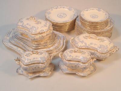 An early 20thC Staffordshire pottery dinner service comprising six shaped