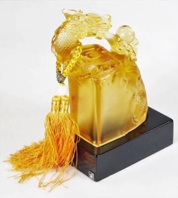 A Chinese amber coloured glass figure of a dragon, stamped and named to the front, on a plinth base, 24cm H. (boxed) - 3