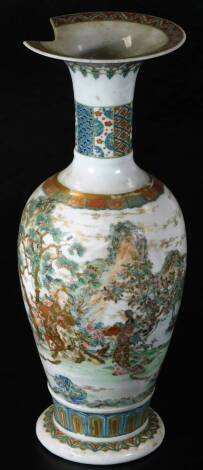 A Japanese Meiji period Satsuma vase, with trumpet stem and shouldered body, profusely decorated with an exterior scene of figures, trees and mountains, with gilt highlights in blue and green, with a lower floral banding, on a circular foot, unmarked, 40c