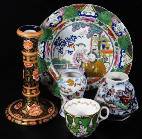 A Victoria Ironstone candle stick in Imari type decoration, a Masons Ironstone jar, Ashworth type of inverted form and a 19thC plate decorated with oriental figures. (5)