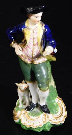 An early 19thC Derby porcelain figure of a gentleman, dressed in finery, aside dog, on a gilt highlighted rockwork base, polychrome decorated, predominantly in blue, green and pink, marked No 60 beneath, 13cm H.