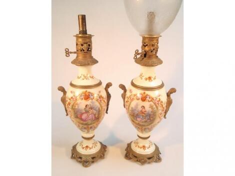 A pair of Continental porcelain lamps of ovoid form