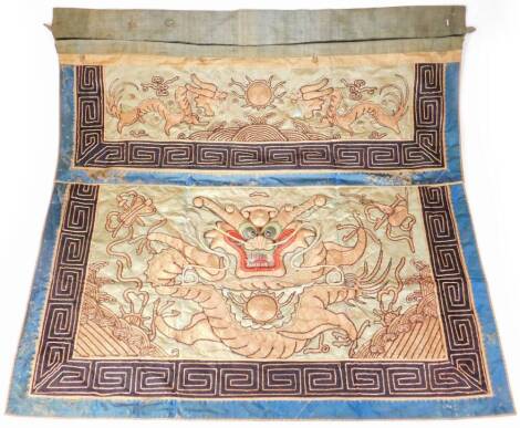 A Chinese Qing period silk and wirework wall hanging, raised with a dragon on a material ground, with a bullion work outline in gilt and blue colours, 84cm x 84cm.