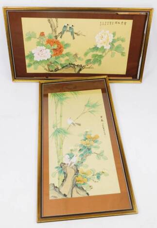 Two similar oriental material and silk watercolours, of rectangular form, decorated with flowers, birds and script, signed, 100cm x 50cm.