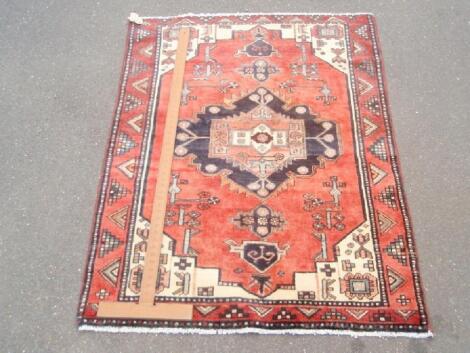 A pink and cream Persian design modern rug