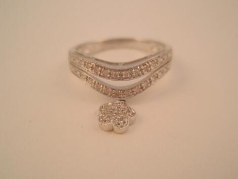 A white metal and diamond set dress ring