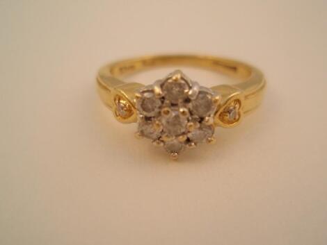 An 18ct gold diamond set floral cluster ring