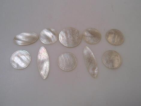 A small quantity of both circular and oval mother of pearl engraved counters