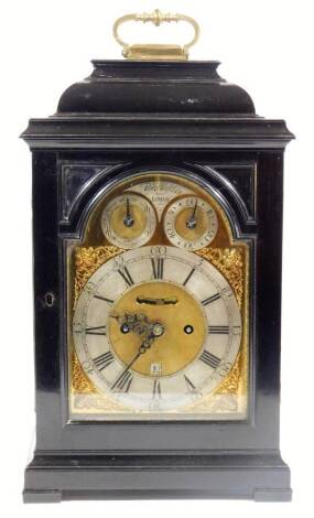 Thomas Hughes London (active 1742-1785). An 18thC bracket clock, in ebonised caddy case with swing handle, with four part glass sections, on bracket feet, the arched dial with raised spandrels and 16cm Dia. silvered chapter ring, with Roman numeric and A