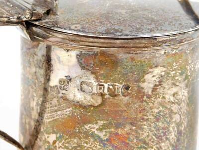 A Victorian silver mustard pot, of cylindrical form, with thumb mould top, shaped handle, blue glass liner and associated spoon, 2½oz. - 2