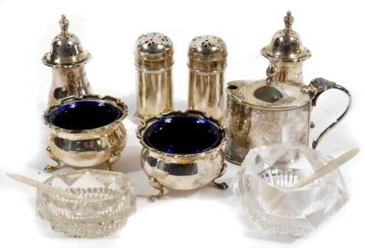 Various silver, comprising a matched 20thC condiment set, to include mustard pot, 5cm H, Birmingham 1939, various other salt pots, open salts, blue glass liners, etc. 5oz. (a quantity, various dates and makers)