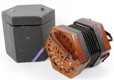 An early 20thC Chanel La Chenal & Co concertina, of hexagonal form, with one end partially pierced and set with eleven buttons with strap, in fitted case, (labelled)