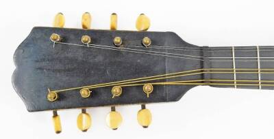 An early 20thC mandolin, of shaped form, with one piece polished back, ebonised end with articulated tuning knops, labelled International College of Music, sold only by The International College of Music, 230 Edgware Road, London W, 61cm W. (cased) - 4