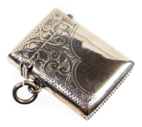 An Edwardian silver vesta case, of rectangular form partially etched with scrolls, with ring side, and match strike base, Birmingham 1902, 4cm H.