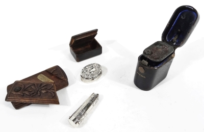 An Edwardian silver pill box, of oval form, repoussé decorated to the lid with scrolls, with vacant cartouche, Birmingham 1902, 4cm W, snuff box, leather cased lighter, etc. (a quantity) - 2