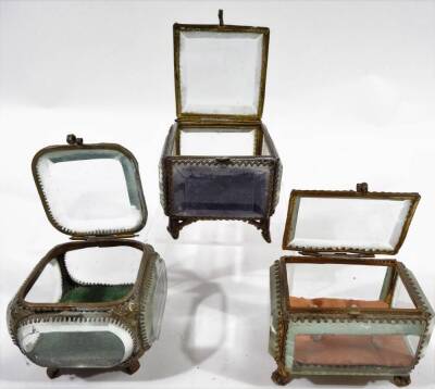 Three early 20thC glazed jewellery caskets, with five sided glass panelling and velvet lined interior, on shaped metal feet, 7cm H, 8cm W, 8cm D, etc. and various jewellery, a silver and enamel butterfly brooch, floral brooch, costume jewellery, etc. (a - 2