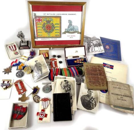 Various medals, associated ephemera, buttons, figures, photographs, postcards, to include a WWI medal trio, with 1914-15 V Star, Campaign and Victory medals, each similarly marked 4554 DVR S D Brown RA, associated postcards and ephemera including a photo