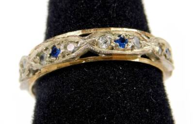 A 9ct gold and silver eternity ring, set with blue and white paste stones, ring size N, 2g all in.