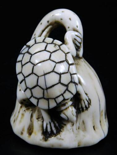 An unusual Japanese ivory netsuke of a tortoise on lotus leaf, with semi precious stones, Taisho period, 4cm H.