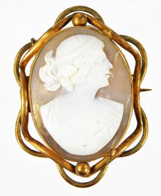 A 20thC cameo brooch, carved with lady facing sinister, with an entwined setting with plain pin back, unmarked, 5.5cm H.