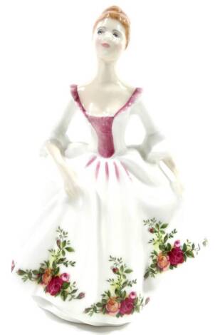 A Royal Doulton figure Country Rose, HN3221, by Peggy Davis, printed marks beneath, 22cm H.